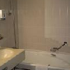 Badezimmer in Thermal- und  Konferenzhotel Helia in Budapest